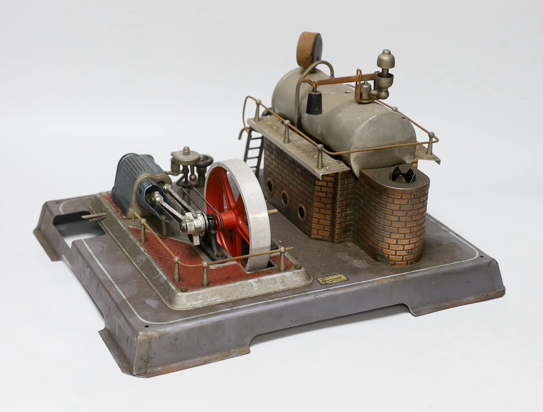 A Gamages single-cylinder steam engine, flywheel diameter 10cm